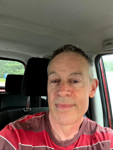 Rolfe Hanson in his car