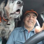 Mark Parman with his dog in a car.