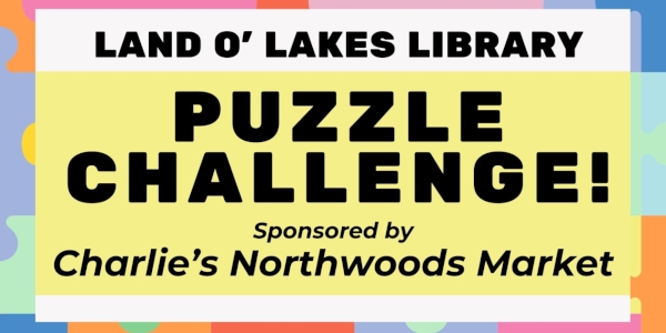 Banner for a Puzzle Challenge at Land O' Lakes Library, sponsored by Charlie’s Northwoods Market.